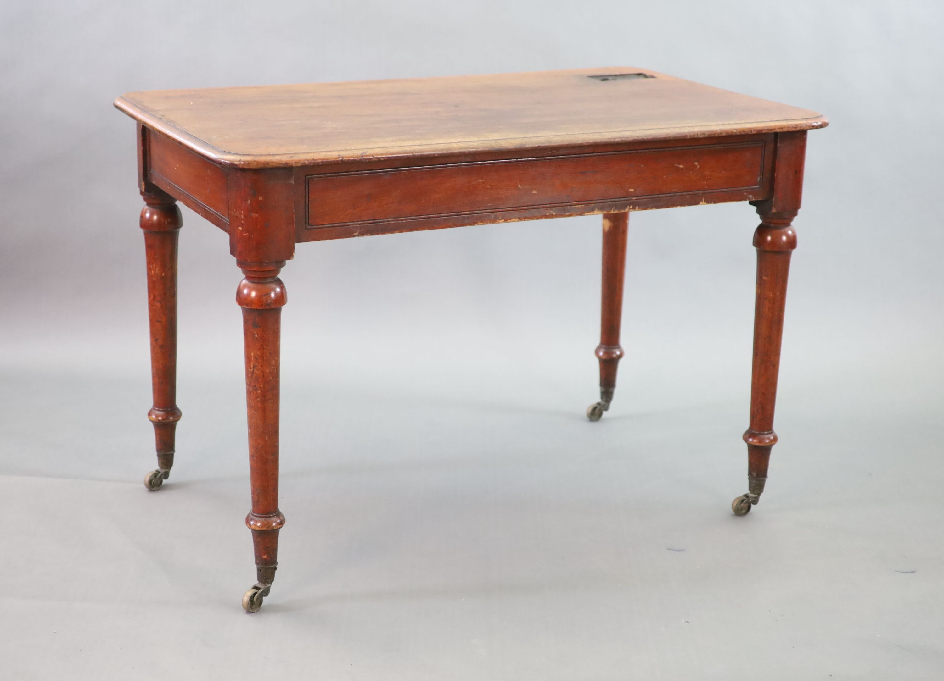 A Victorian mahogany writing table, W.114cm D.70cm H.77cm
